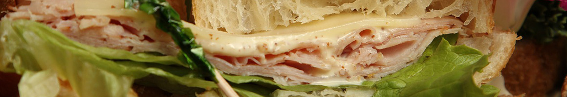 Eating Deli Sandwich at La Crema Food and Grill restaurant in Doral, FL.